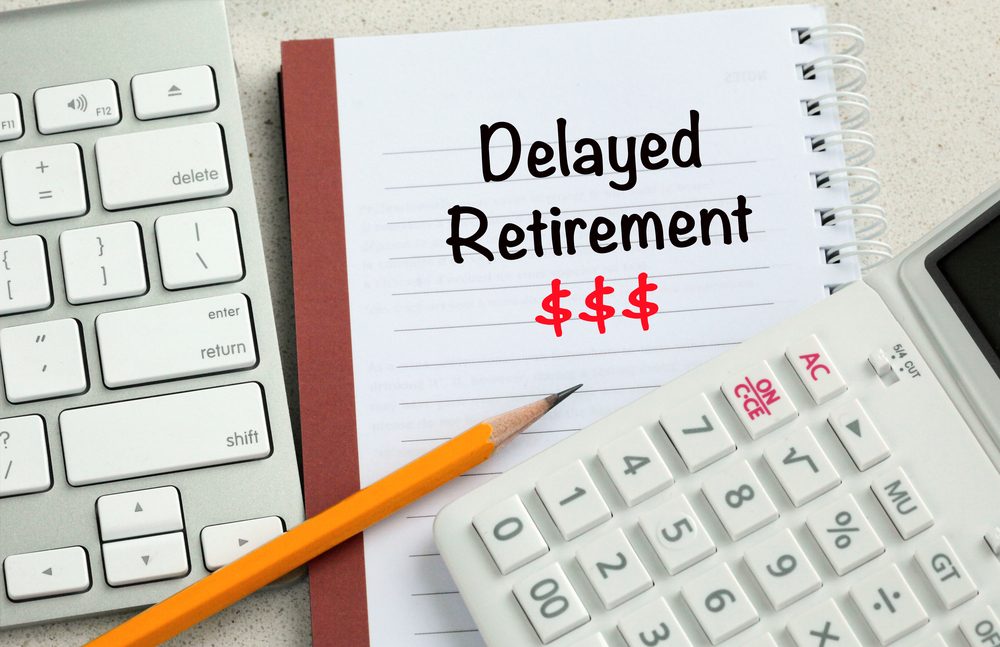 Concept,Of,Delayed,Retirement,With,Money,Sign,And,Calculator